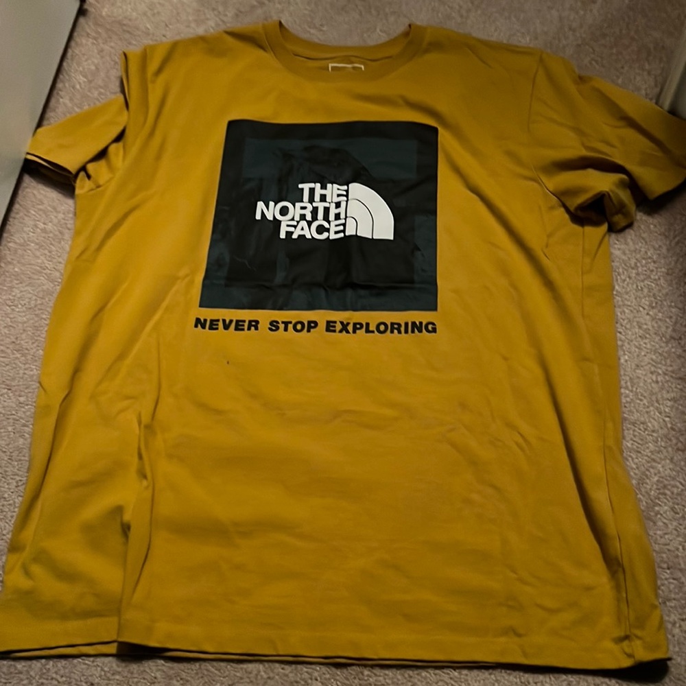 gold yellow north face shirt